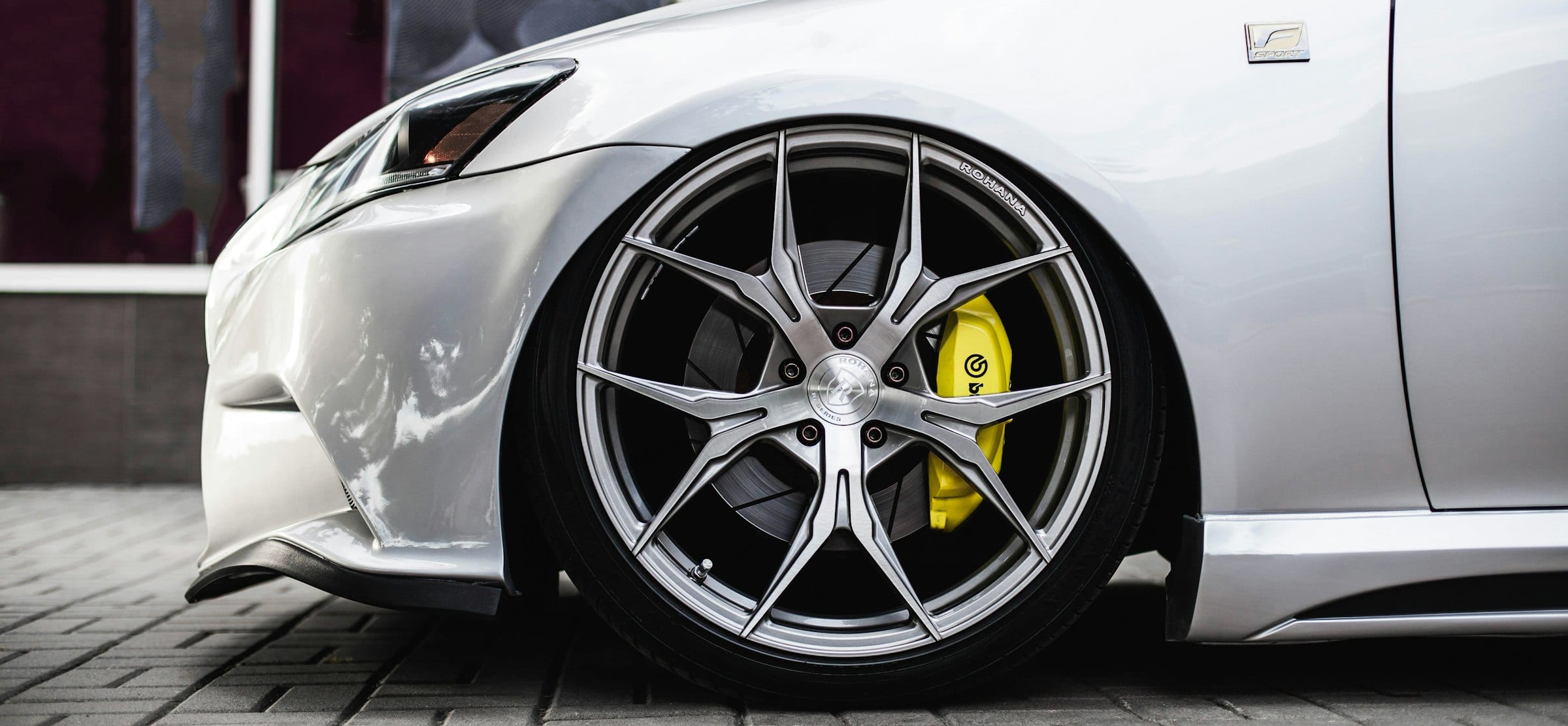 Brushed forged multi-spoke wheel fitted to a performance car